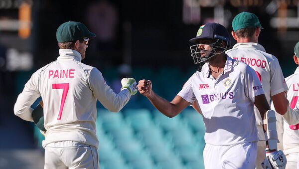 (FILES) This file photo taken on January 11, 2021 shows India's Ravichandran Ashwin (R) fist-bumping with Australia's captain Tim Paine (L) at the end of the third cricket Test match between Australia and India at the Sydney Cricket Ground (SCG) in Sydney. - Sputnik International