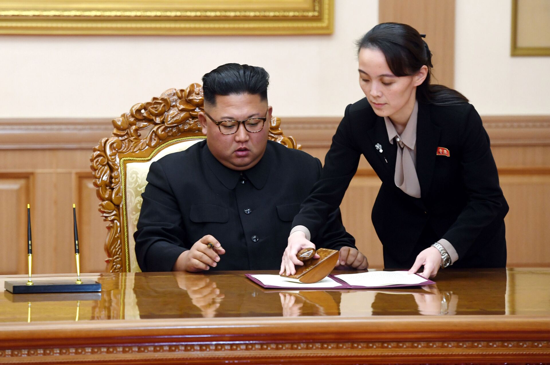 In this Sept. 19, 2018, file photo, Kim Yo Jong, right, sister of North Korean leader Kim Jong Un, helps Kim sign joint statement following the summit with South Korean President Moon Jae-in at the Paekhwawon State Guesthouse in Pyongyang, North Korea. Kim's prolonged public absence has led to rumors of ill health and worries about how it could influence the future of what one analyst calls Northeast Asia's Achilles' heel, a reference to the North's belligerence and unpredictable nature. - Sputnik International, 1920, 07.09.2021