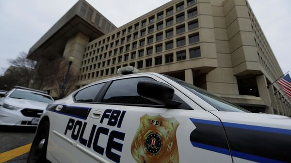 FILE PHOTO: FBI Police vehicles sit outside FBI building in Washington - Sputnik International