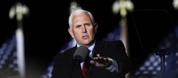  In this Oct. 28, 2020, file photo Vice President Mike Pence speaks at a campaign event in Flint, Mich. A group of Democratic lawmakers on Monday, Nov. 2, called on the Trump administration to stop the expulsion of unaccompanied children and other asylum seekers at the U.S. border using emergency powers granted during the coronavirus pandemic. - Sputnik International