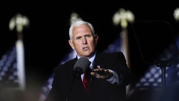  In this Oct. 28, 2020, file photo Vice President Mike Pence speaks at a campaign event in Flint, Mich. A group of Democratic lawmakers on Monday, Nov. 2, called on the Trump administration to stop the expulsion of unaccompanied children and other asylum seekers at the U.S. border using emergency powers granted during the coronavirus pandemic. - Sputnik International