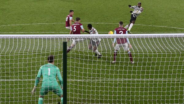 Manchester United's French midfielder Paul Pogba (2R) scores the opening goal during the English Premier League football match between Burnley and Manchester United at Turf Moor in Burnley, north west England on January 12, 2021. - Sputnik International