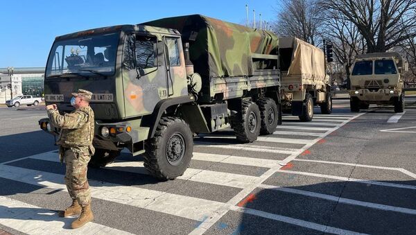 Military trucks block streets adjacent to the Capitol area in Washington, DC - Sputnik International
