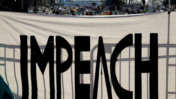 A protest sign reading Impeach is seen on Black Lives Matter Plaza near the White House one week after rioters stormed the U.S. Capitol building in Washington, U.S., January 13, 2021 - Sputnik International
