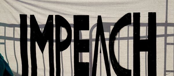 A protest sign reading Impeach is seen on Black Lives Matter Plaza near the White House one week after rioters stormed the U.S. Capitol building in Washington, U.S., January 13, 2021 - Sputnik International