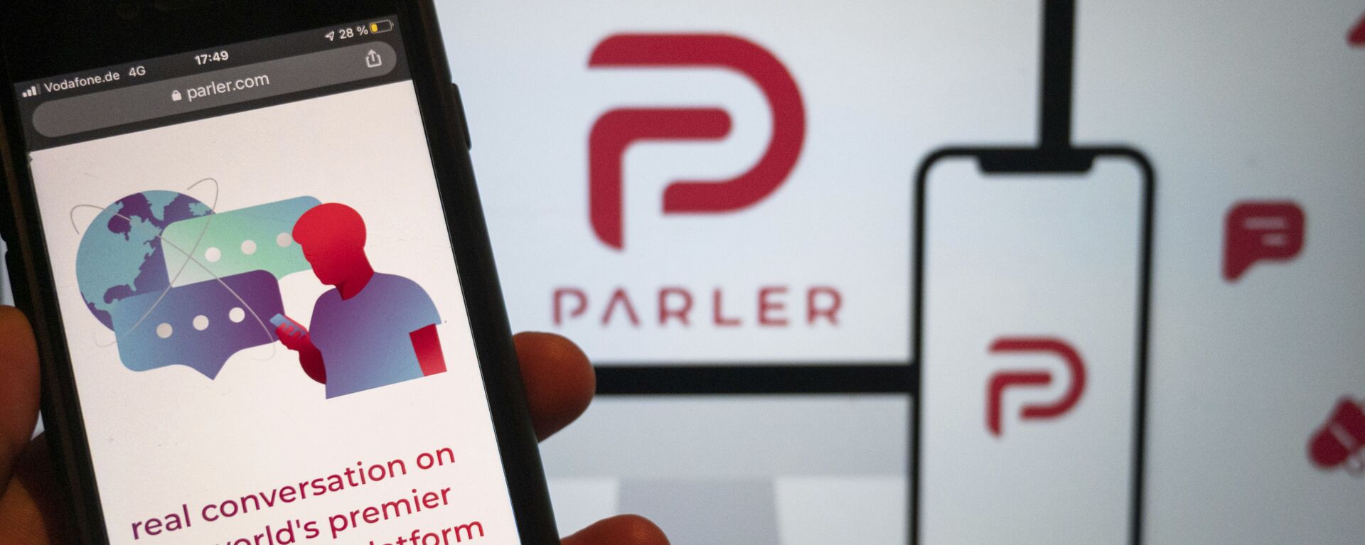 The website of the social media platform Parler is displayed in Berlin, Jan. 10, 2021. The platform's logo is on a screen in the background. The conservative-friendly social network Parler was booted off the internet Monday, Jan. 11, over ties to last week's siege on the U.S. Capitol, but not before hackers made off with an archive of its posts, including any that might have helped organize or document the riot.  - Sputnik International, 1920, 11.03.2021