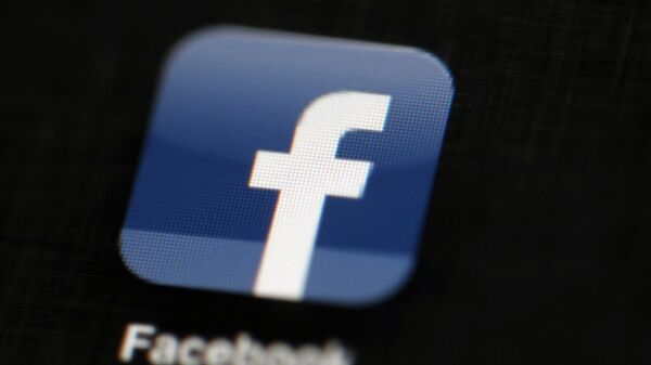 In this 16 May 2012, file photo, the Facebook logo is displayed on a mobile device in Philadelphia - Sputnik International