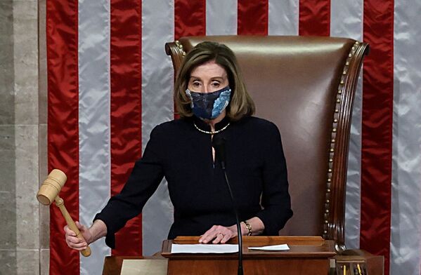 U.S. House Speaker Nancy Pelosi presides over the vote to impeach President Donald Trump for a second time, a week after his supporters stormed the Capitol building, on the floor of the House of Representatives in Washington, 13 January 2021.  - Sputnik International