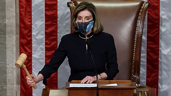 US House Speaker Nancy Pelosi (D-CA) presides over the vote to impeach President Donald Trump for a second time, a week after his supporters stormed the Capitol building, on the floor of the House of Representatives in Washington 13 January 2021.  - Sputnik International