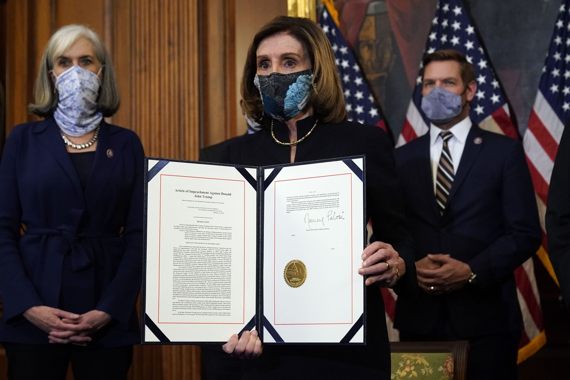 House Speaker Nancy Pelosi of Calif., displays the signed article of impeachment against President Donald Trump in an engrossment ceremony before transmission to the Senate for trial on Capitol Hill, in Washington, Wednesday, Jan. 13, 2021.  - Sputnik International, 1920, 07.09.2021