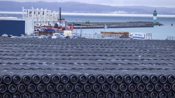Pipes for the construction of the Nord Stream 2 natural gas pipeline from Russia to Germany and the Baltic Pipe from Denmark to Poland are stored at the port of Mukran in Sassnitz on the island of Ruegen, Germany, Wednesday, Jan. 6, 2021 - Sputnik International