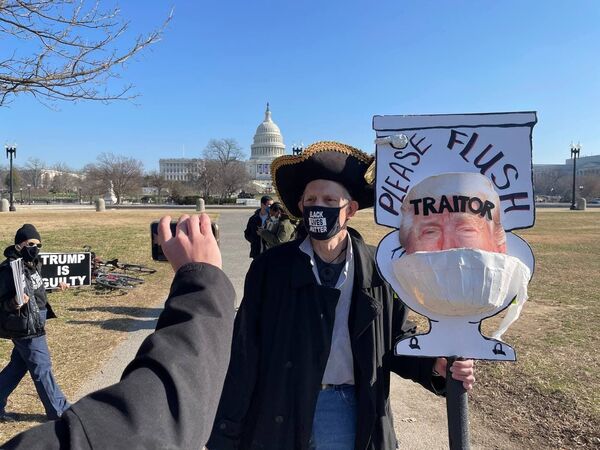 An anti-Trump activist outside the US Capitol on Washington, DC.  - Sputnik International