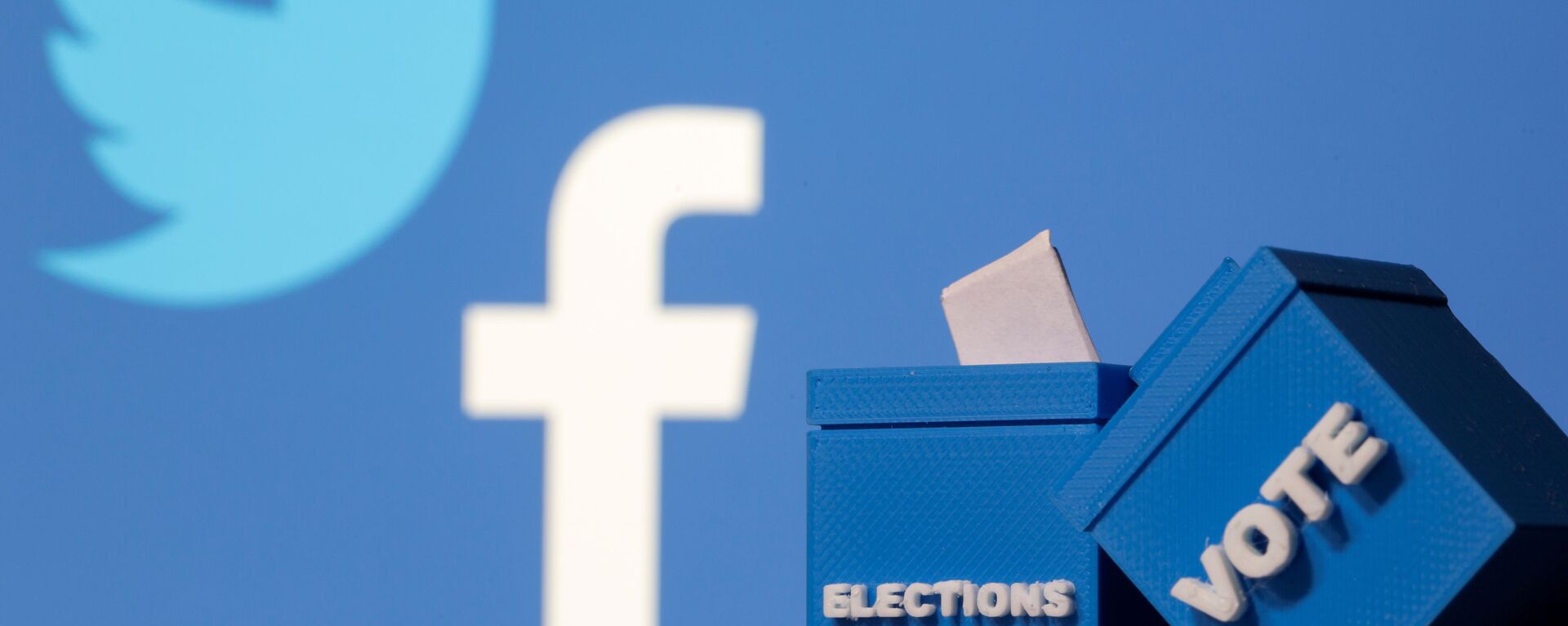 3D-printed ballot boxes are seen in front of displayed Facebook and Twitter logos in this illustration taken November 4, 2020 - Sputnik International, 1920, 14.01.2021