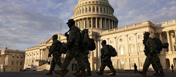 National Guard members walk in front of the U.S. Capitol after the House voted to impeach U.S. President Donald Trump in Washington, U.S., January 14, 2021 National Guard members walk in front of the U.S. Capitol after the House voted to impeach U.S. President Donald Trump in Washington, U.S., January 14, 2021 - Sputnik International
