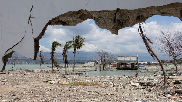 Ruins and damaged building are pictured nearly one year after an earthquake and tsunami at a beach in Palu, Central Sulawesi, Indonesia - Sputnik International