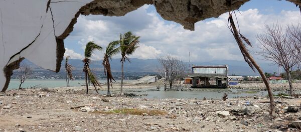 Ruins and damaged building are pictured nearly one year after an earthquake and tsunami at a beach in Palu, Central Sulawesi, Indonesia Ruins and damaged building are pictured nearly one year after an earthquake and tsunami at a beach in Palu, Central Sulawesi, Indonesia - Sputnik International