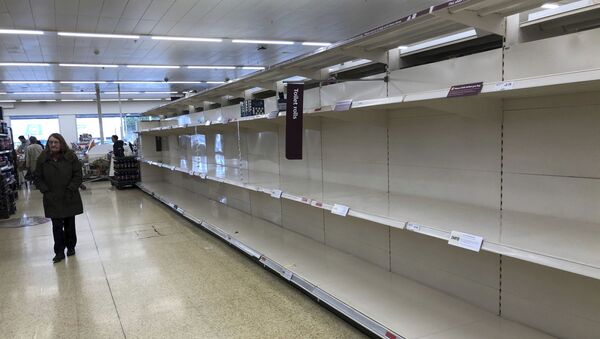 Empty shelves where toilet roll is usually stocked in a supermarket in Durham, England, Tuesday March 17, 2020, after British authorities ramped up public health measures Monday, telling people who are in the groups considered most vulnerable to severe COVID-19 illness to stay at home for three months - Sputnik International