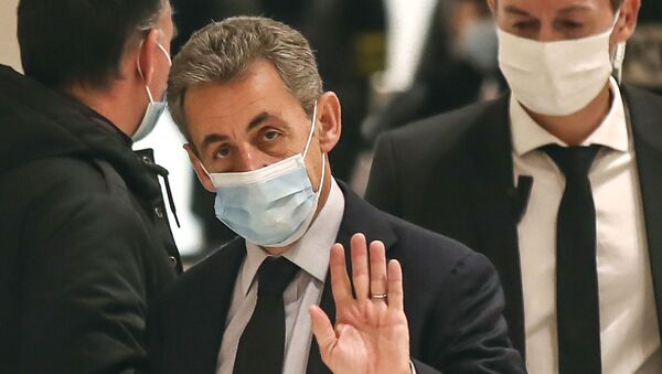 Former French President Nicolas Sarkozy waves to the media as he arrives at the courtroom in Paris, Friday, Dec. 10, 2020 - Sputnik International