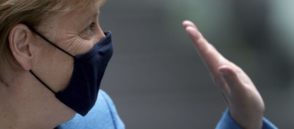 German Chancellor Angela Merkel waves as she leaves after her annual summer press conference in Berlin, Germany, Friday, Aug. 28, 2020 - Sputnik International