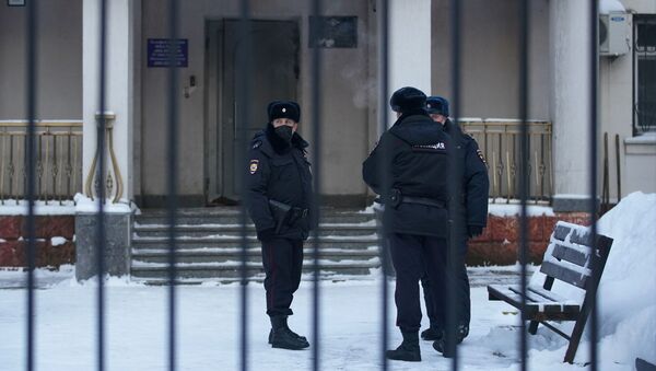 Police officers stand outside a police station where detained Russian opposition leader Alexei Navalny is being held, in Khimki outside Moscow, Russia January 18, 2021 - Sputnik International