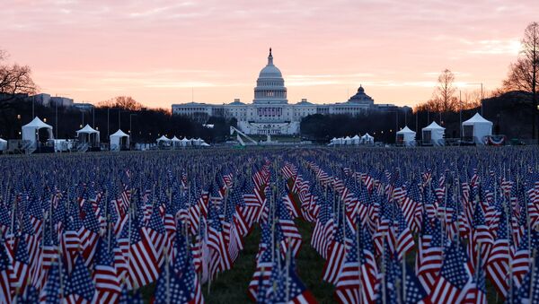 Thousands of US flags are seen at the National Mall, as part of a memorial paying tribute to the more than 200,000 people nationwide who have died from the coronavirus disease (COVID-19), near the US Capitol ahead of President-elect Joe Biden's inauguration, in Washington, DC, US, 18 January 2021. - Sputnik International