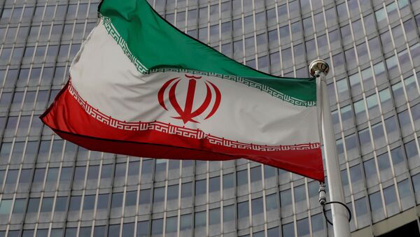 An Iranian flag flutters in front of the International Atomic Energy Agency (IAEA) headquarters in Vienna, Austria September 9, 2019 - Sputnik International