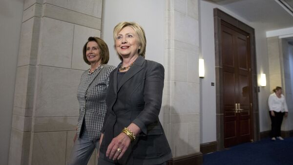 Democratic presidential candidate Hillary Clinton walks with House Minority Leader Nancy Pelosi of Calif. as they arrive for a meeting with the House Democratic Caucus, Wednesday, June 22, 2016, on Capitol Hill in Washington. (AP Photo/Alex Brandon) - Sputnik International