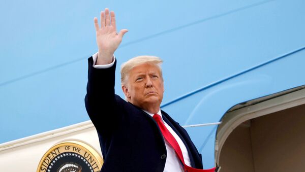 U.S. President Donald Trump salutes as he boards Air Force One at after visiting the U.S.-Mexico border wall, in Harlingen, Texas, U.S., January 12, 2021. - Sputnik International