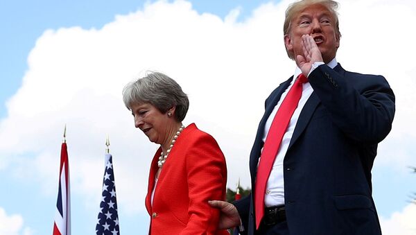  Britain's Prime Minister Theresa May and U.S. President Donald Trump walk away after holding a joint news conference at Chequers, the official country residence of the Prime Minister, near Aylesbury, Britain, July 13, 2018 - Sputnik International