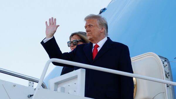 U.S. President Donald Trump, accompanied by first lady Melania Trump, waves as he boards Air Force One at Joint Base Andrews, Maryland, U.S., January 20, 2021. REUTERS/Carlos Barria - Sputnik International