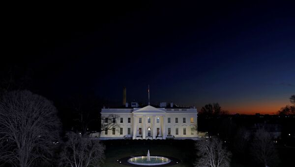 The sun sets near the White House on the final night of Donald Trump's presidency, ahead of U.S. President-elect Joe Biden's inauguration, in Washington, U.S., January 19, 2021 - Sputnik International