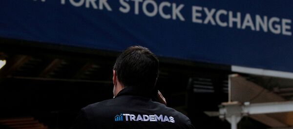 Trader Frank Masiello talks on his phone on Wall St. outside the New York Stock Exchange (NYSE) in New York, U.S., January 15, 2021. - Sputnik International