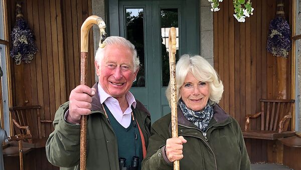 Britain's Prince Charles, Prince of Wales and Camilla, Duchess of Cornwall holding shepherd's crooks pose for a photo at Birkhall on the Balmoral Estate, in Scotland, Britain - Sputnik International