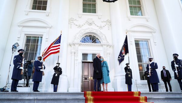 US President Joe Biden kisses first lady Jill Biden as they stand at the North Portico of the White House, in Washington, DC, 20 January 2021. - Sputnik International