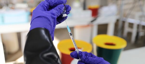 A medical worker prepares to administer a vaccination against the coronavirus disease (COVID-19) as Israel continues its national vaccination campaign amid a third COVID-19 lockdown, at a drive-through vaccination centre in Haifa, Israel January 6, 2021.  - Sputnik International