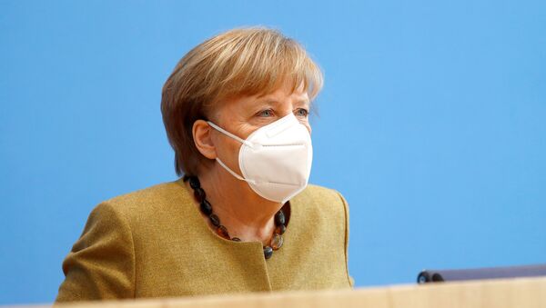 German Chancellor Angela Merkel leaves following a news conference about the current situation of the spread of the coronavirus disease (COVID-19), in Berlin, Germany, January 21, 2021.  - Sputnik International
