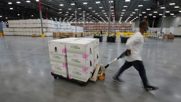 FILE PHOTO: Boxes containing the Moderna COVID-19 vaccine are prepared to be shipped at the McKesson distribution center in Olive Branch, Mississippi, U.S. December 20, 2020 - Sputnik International