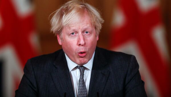 Britain's Prime Minister Boris Johnson speaks during a news conference announcing tightening of COVID-19 tiers, at Downing Street in London, Britain December 30, 2020.  - Sputnik International