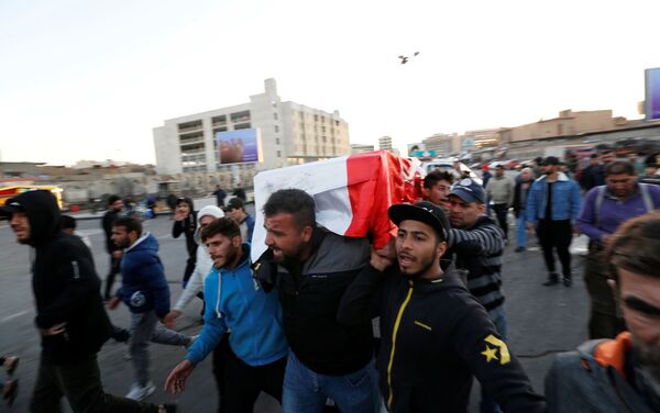 Mourners carry the coffin of a man who was killed in a twin suicide bombing attack in a central Baghdad market, during his funeral in Baghdad, Iraq January 21, 2021. - Sputnik International