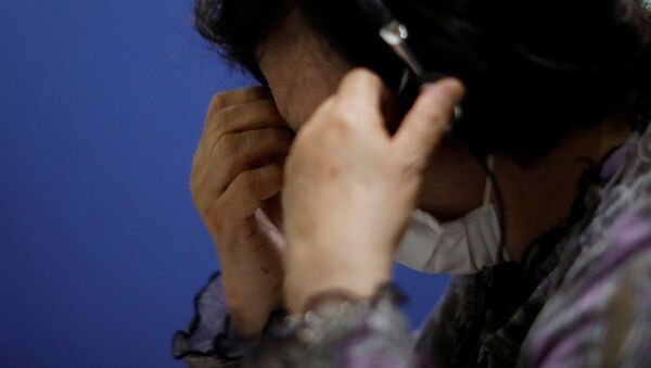 A volunteer responds an incoming call at the Tokyo Befrienders call centre, a Tokyo suicide hotline centre, during the spread of the coronavirus disease (COVID-19), in Tokyo, Japan, 26 May 2020. - Sputnik International