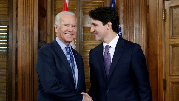 Canada's Prime Minister Justin Trudeau (R) shakes hands with U.S. Vice President Joe Biden during a meeting in Trudeau's office on Parliament Hill in Ottawa, Ontario, Canada, December 9, 2016. - Sputnik International