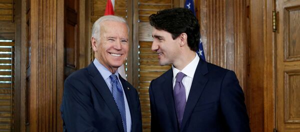 Canada's Prime Minister Justin Trudeau (R) shakes hands with U.S. Vice President Joe Biden during a meeting in Trudeau's office on Parliament Hill in Ottawa, Ontario, Canada, December 9, 2016. - Sputnik International