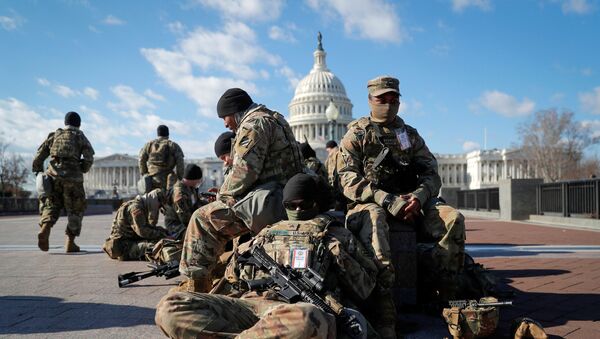 National Guard troops gather in front of the U.S. Capitol one day ahead of President-elect Joe Biden's Inauguration in Washington, U.S. January 19, 2021. - Sputnik International