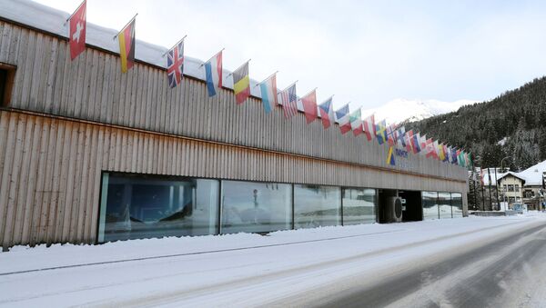 Flags of different countries fly at the congress centre at the Promenade street as the coronavirus disease (COVID-19) continues in Davos, Switzerland January 22, 2021 - Sputnik International