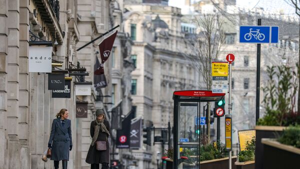 Two women walk down Regent Street, one of London's main shopping streets, as Britain continues its third COVID-19 lockdown, in London, Britain, January 17, 2021. - Sputnik International