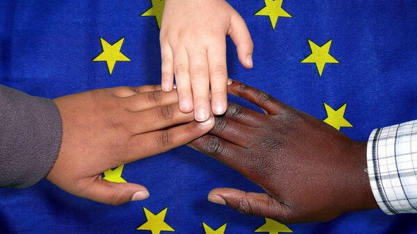 Children touching hands over the flag of the European Union - Sputnik International