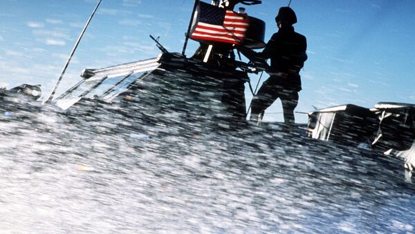 Spray from the bow of a Seafox special warfare patrol craft from Special Boat Unit 12 obscures Sea-Air-Land (SEAL) team members standing on the deck during an exercise - Sputnik International