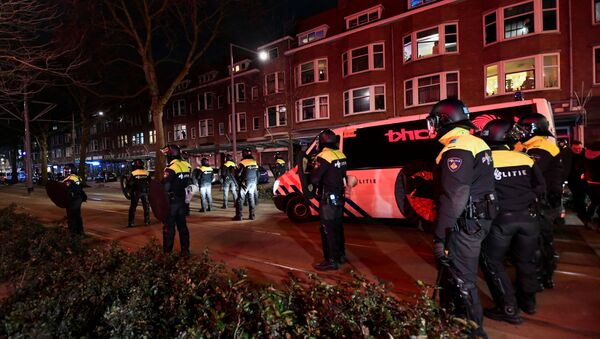 Police officers block a street during a demonstration against restrictions put in place to curb the spread of the coronavirus disease (COVID-19) in Rotterdam, Netherlands, January 26, 2021 - Sputnik International
