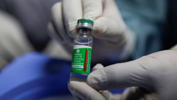 A health worker shows a vial of COVISHIELD, a COVID-19 vaccine manufactured by Serum Institute of India, as she prepares to start vaccination against the coronavirus disease (COVID-19) in Kathmandu, Nepal January 27, 2021.  - Sputnik International