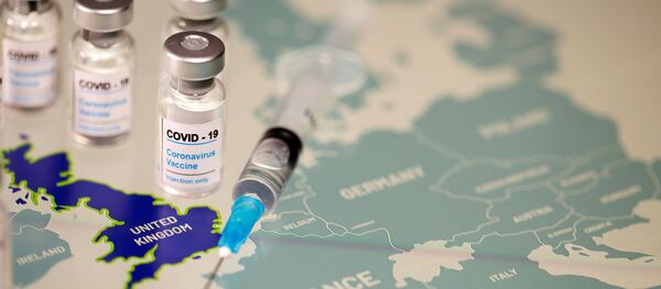 FILE PHOTO: Vials labelled COVID-19 Coronavirus-Vaccine and medical syringe are placed on the European Union map in this picture illustration taken December 2, 2020. - Sputnik International